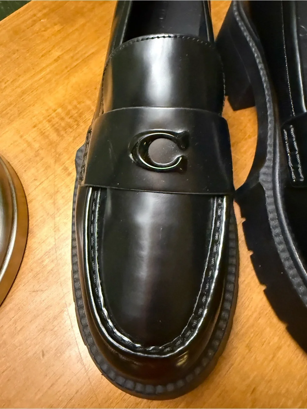 Coach polished black